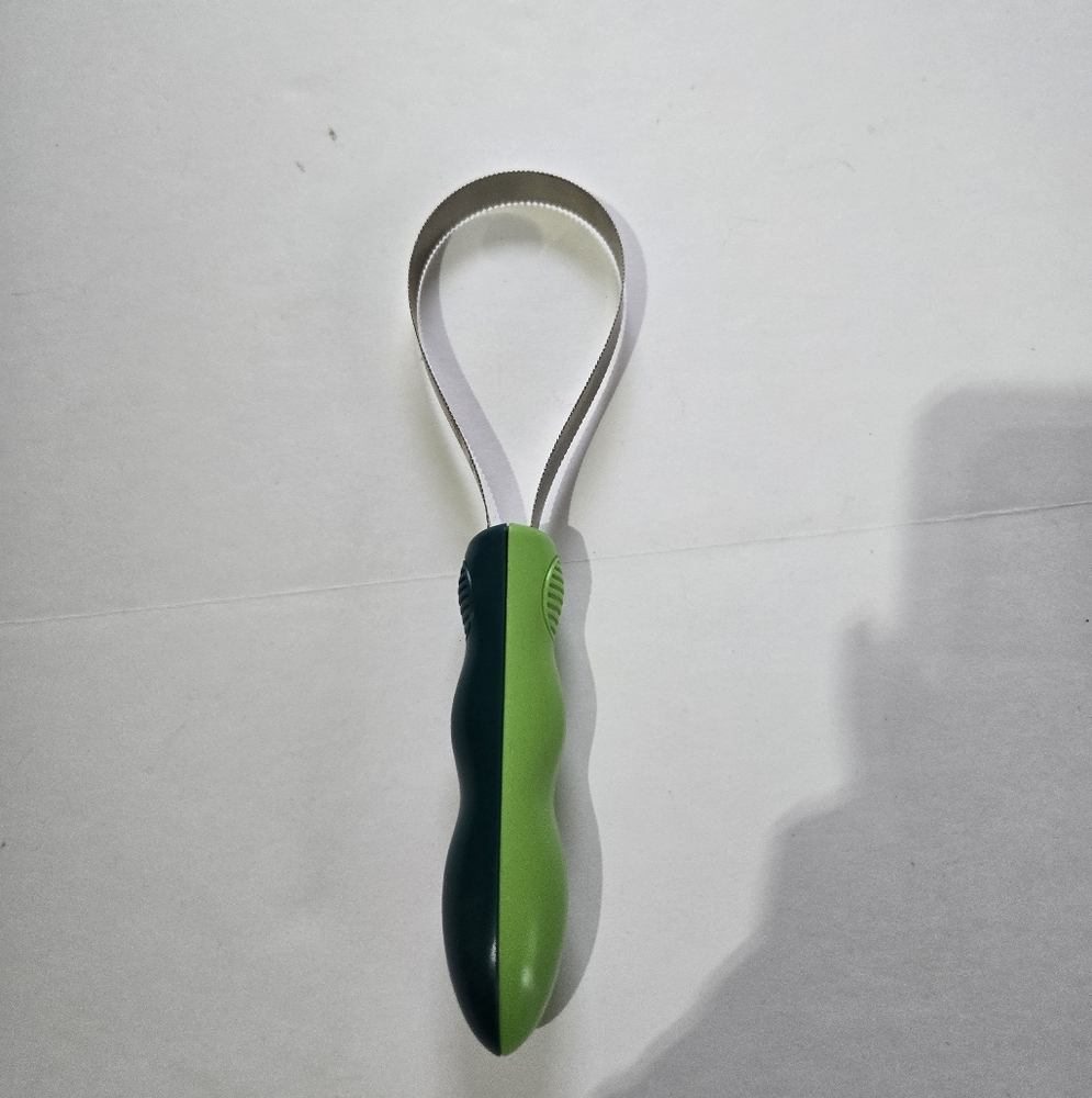 Green and Silver Grooming Tool
